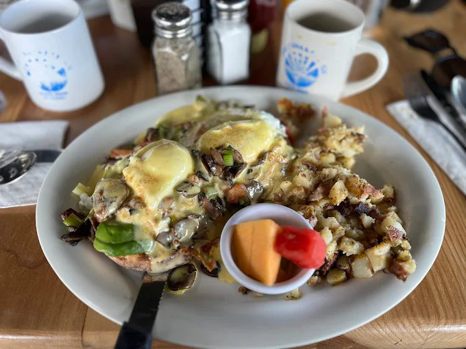Benedict over avocado toast with mushrooms