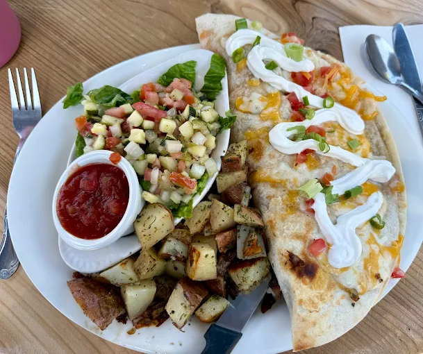 Breakfast quesadilla with salad and potatoes